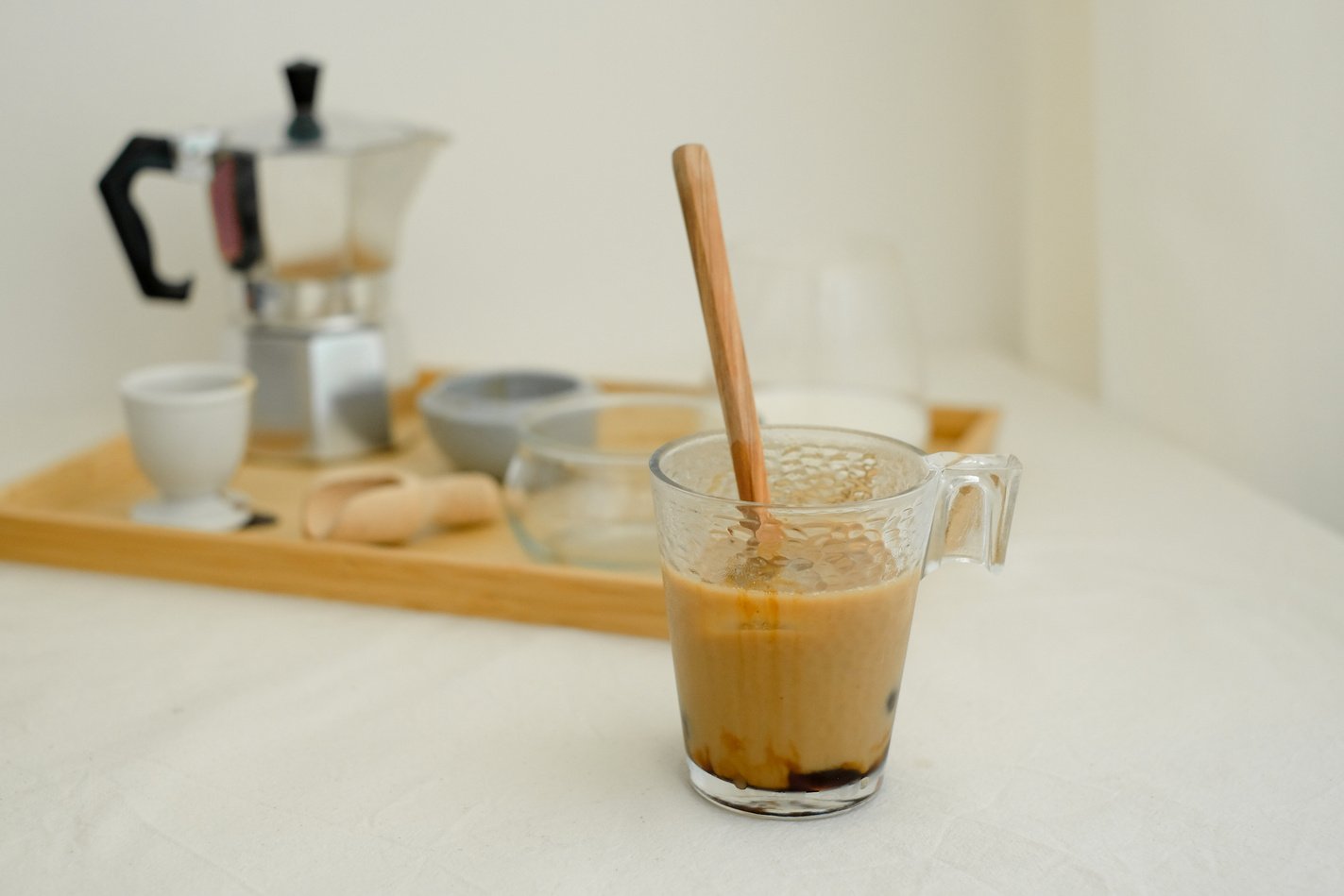 Homemade Cappuccino with Coffee Making Tools on Wooden Tray